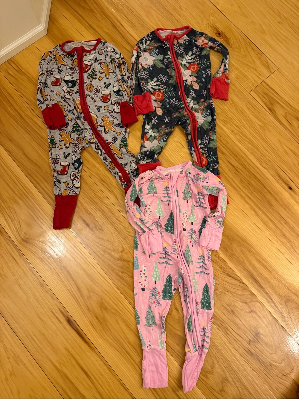 Little Sleepies Holiday Footed Pajama Trio in Pink, Red, Green